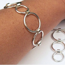 Handgemaakte zilveren armband en set Feliz van flamencosieraden.nl