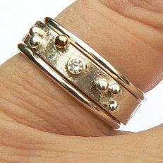 Handgemaakte zilveren ring met goud Sueño met 2 aanschuifringen van flamencosieraden.nl