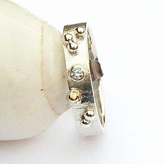 Handgemaakte zilveren ring met goud Sueño van flamencosieraden.nl