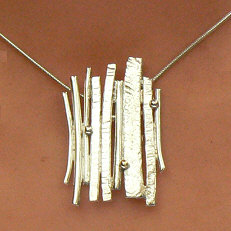 Handgemaakte zilveren hanger met goud El ritmo by Flamenco
