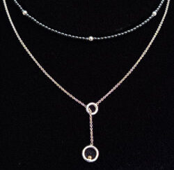 Zilveren set collier hematiet en schuifcollier met gouden bal