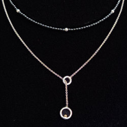 Zilveren set collier hematiet en schuifcollier met gouden bal