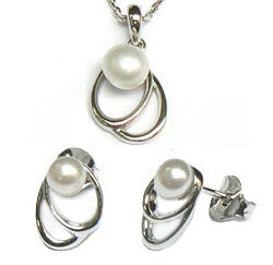 Zilveren set fantasie hanger met oorstekers