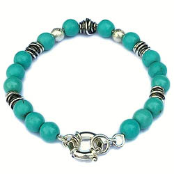 Handgemaakte armband turkoois Turquesa met handgemaakte zilveren tussenstukken en een zilveren siersluiting by Flamenco